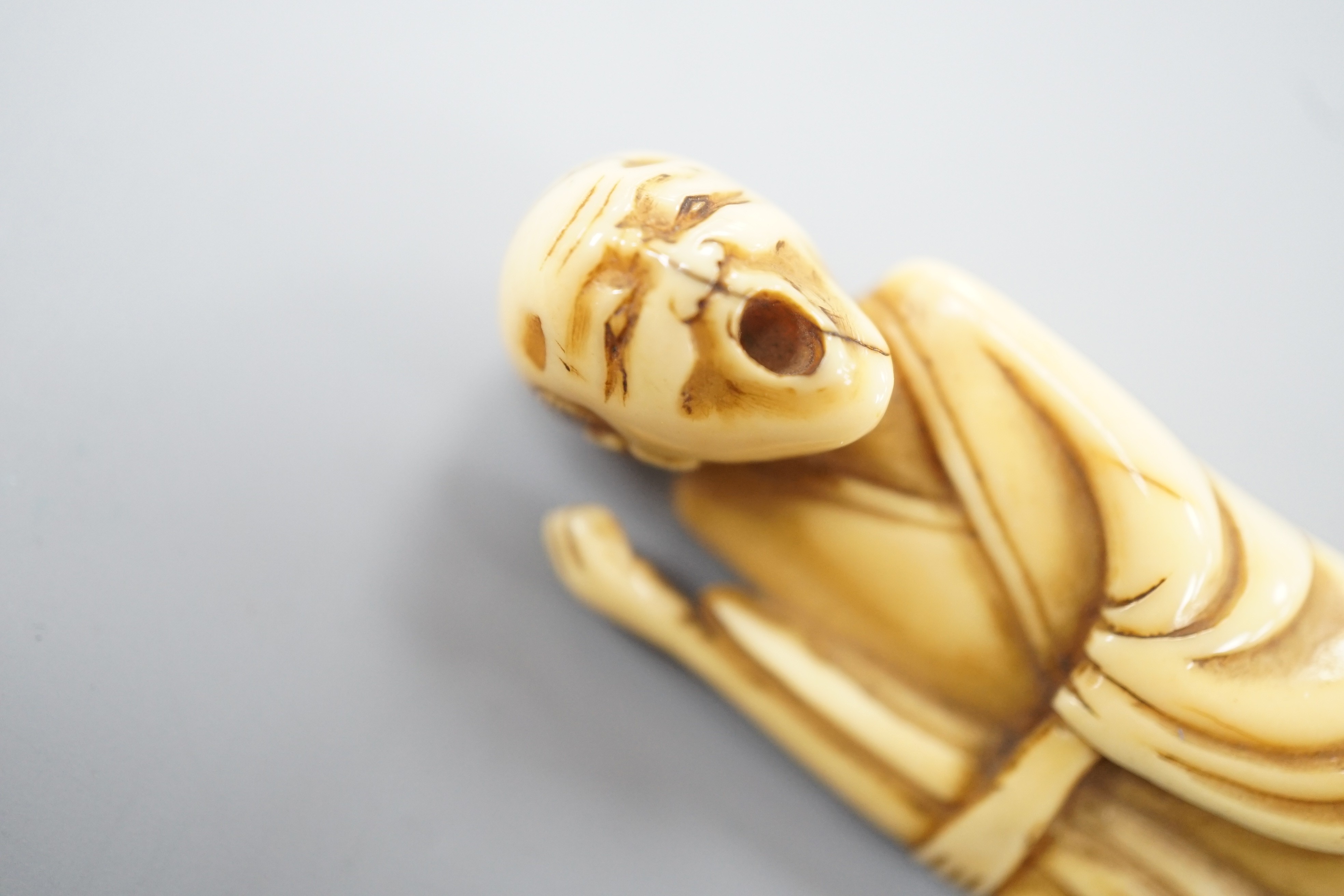 A Japanese ivory netsuke of a howling man, late 18th/early 19th century, 9.4cm